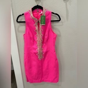 Stunning bright hot pink! This dress zips up the front and is new with tags!